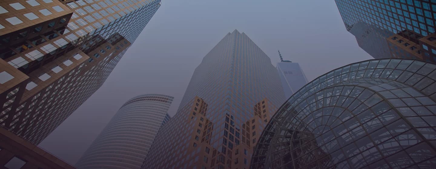 Looking up at skyscrapers through hazy light